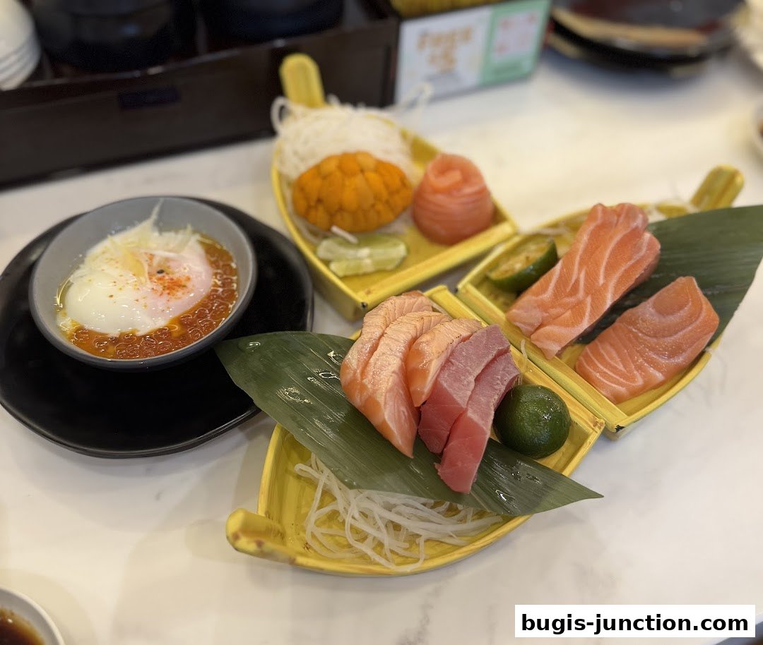 A close-up of a sushi platter featuring salmon sashimi, uni, and a soft-boiled egg with ikura.