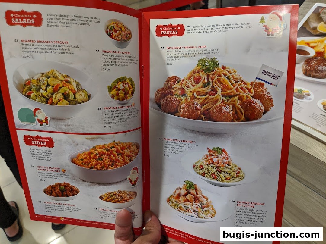 A menu from Swensens Bugis Junction featuring Christmas salads, sides, and pasta dishes.