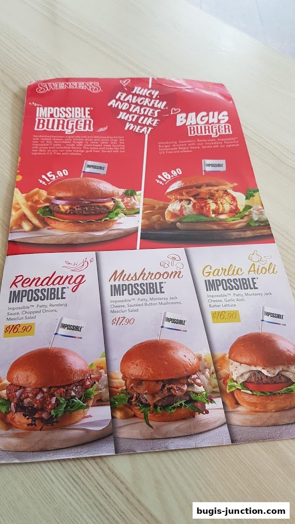 A menu from Swensen's showcasing various Impossible burgers with prices and descriptions.