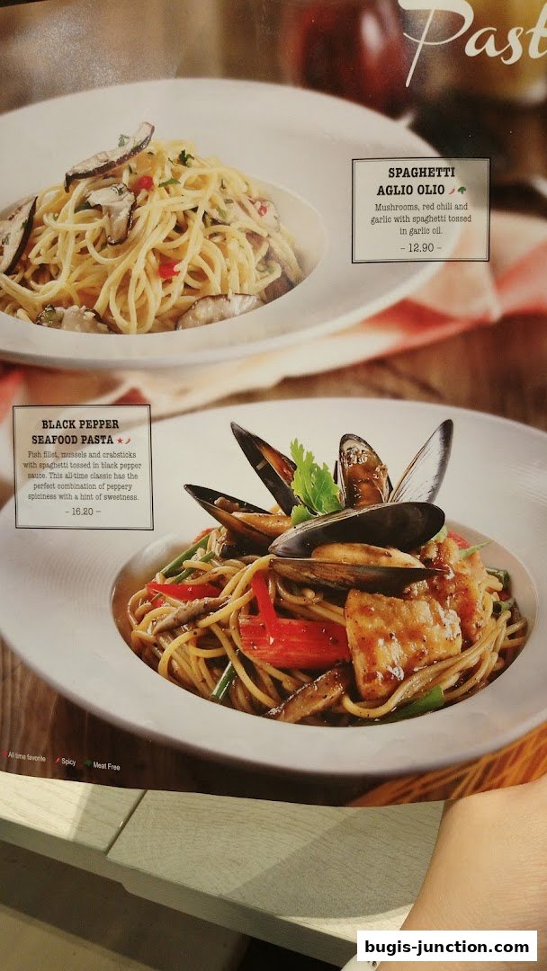 A menu showcasing two pasta dishes: Spaghetti Aglio Olio and Black Pepper Seafood Pasta.