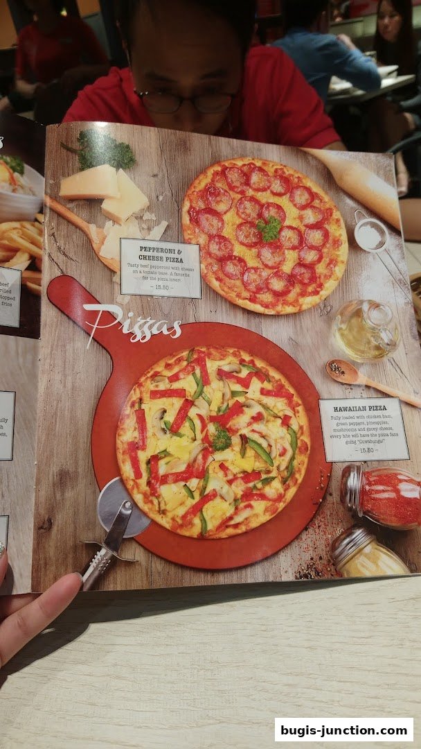 A menu page showcasing two pizzas: Pepperoni & Cheese and Hawaiian.