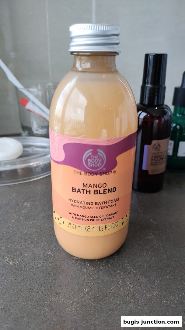 A bottle of The Body Shop Mango Bath Blend hydrating bath foam.