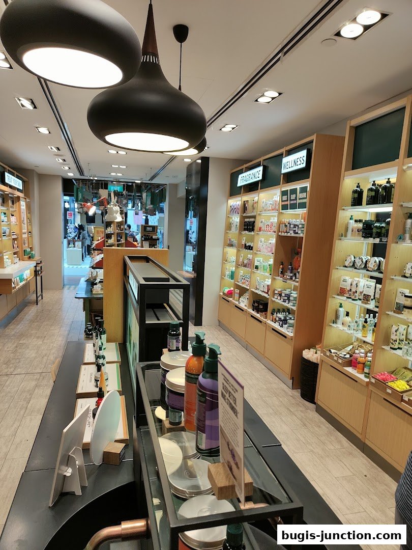 Interior view of The Body Shop, showcasing shelves stocked with skincare and wellness products.