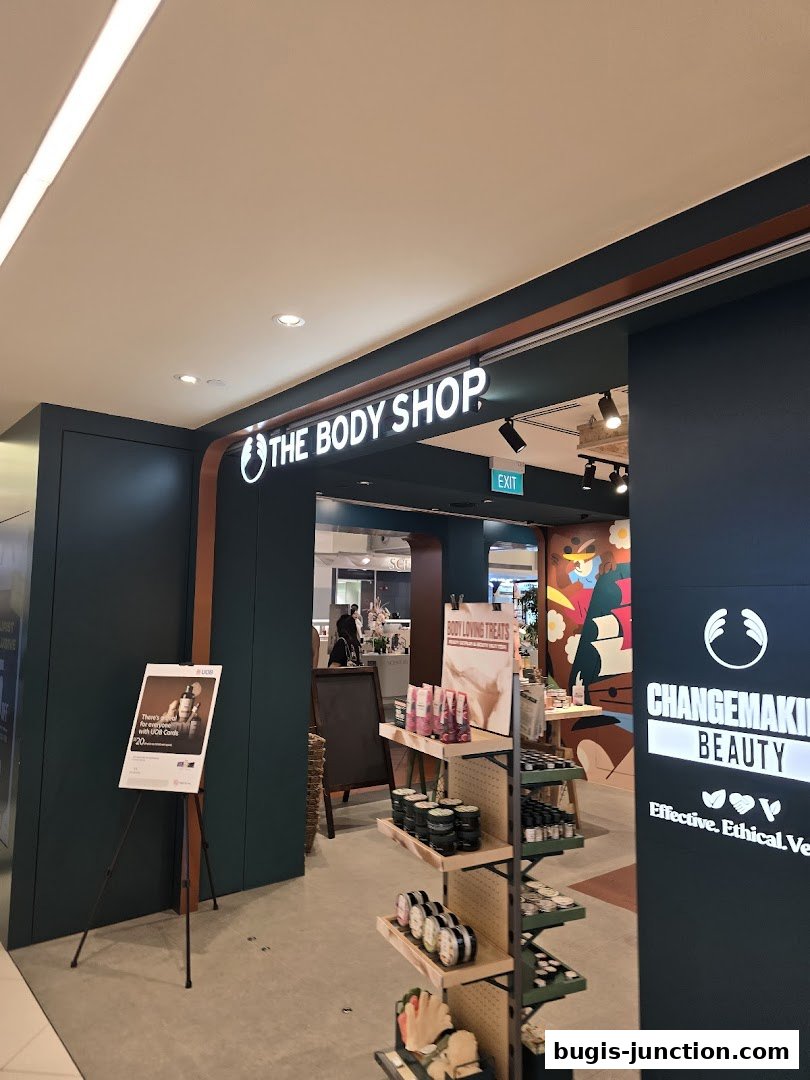 The entrance to The Body Shop, featuring its logo, product displays, and promotional signage.