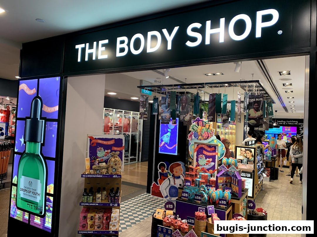 The Body Shop storefront with displays of skincare products and Christmas gifts.