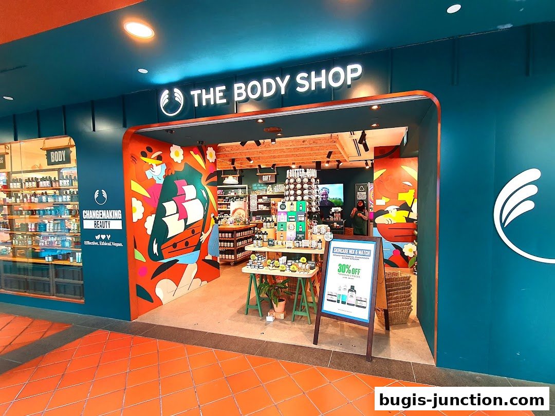 The Body Shop storefront with colorful artwork and a 30% off skincare promotion.