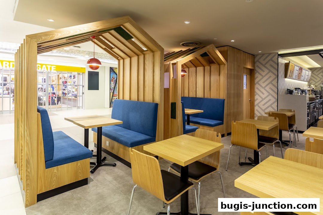 Interior view of The Coffee Bean and Tea Leaf with modern wooden booths and tables.