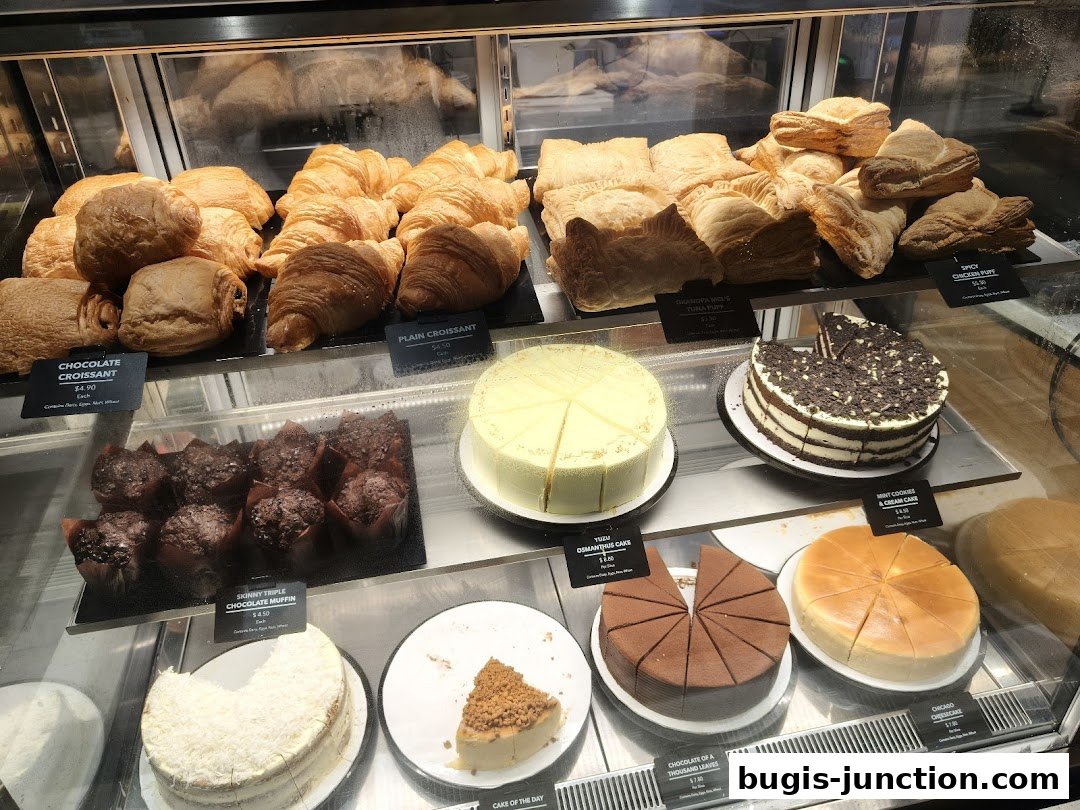 A display case filled with various pastries, cakes, and muffins at The Coffee Bean and Tea Leaf.
