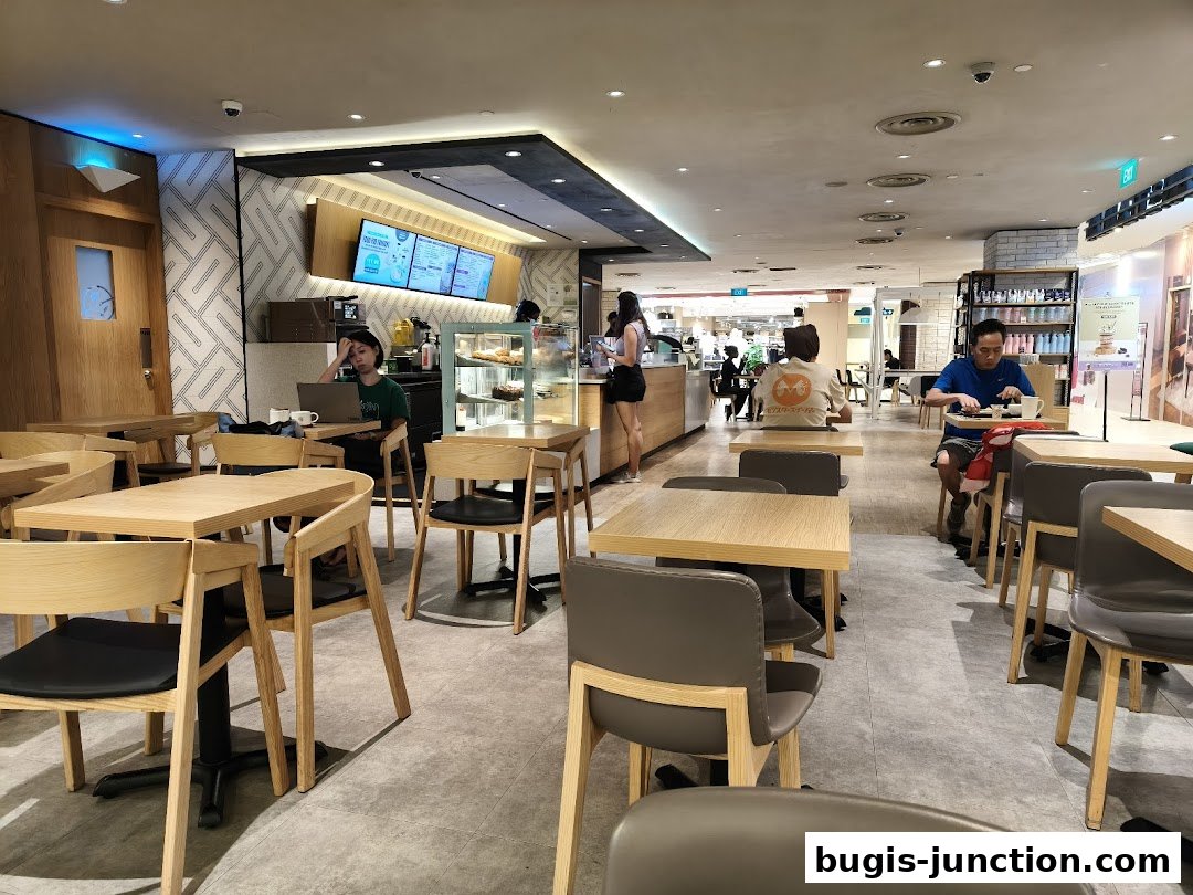 Interior of The Coffee Bean and Tea Leaf with customers seated at tables and staff behind the counter.