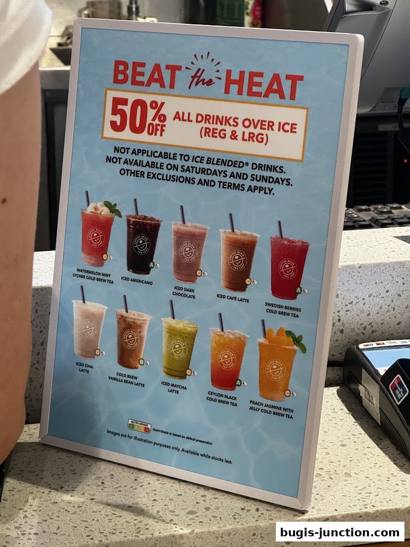 A promotional sign for The Coffee Bean and Tea Leaf offering 50% off drinks over ice.