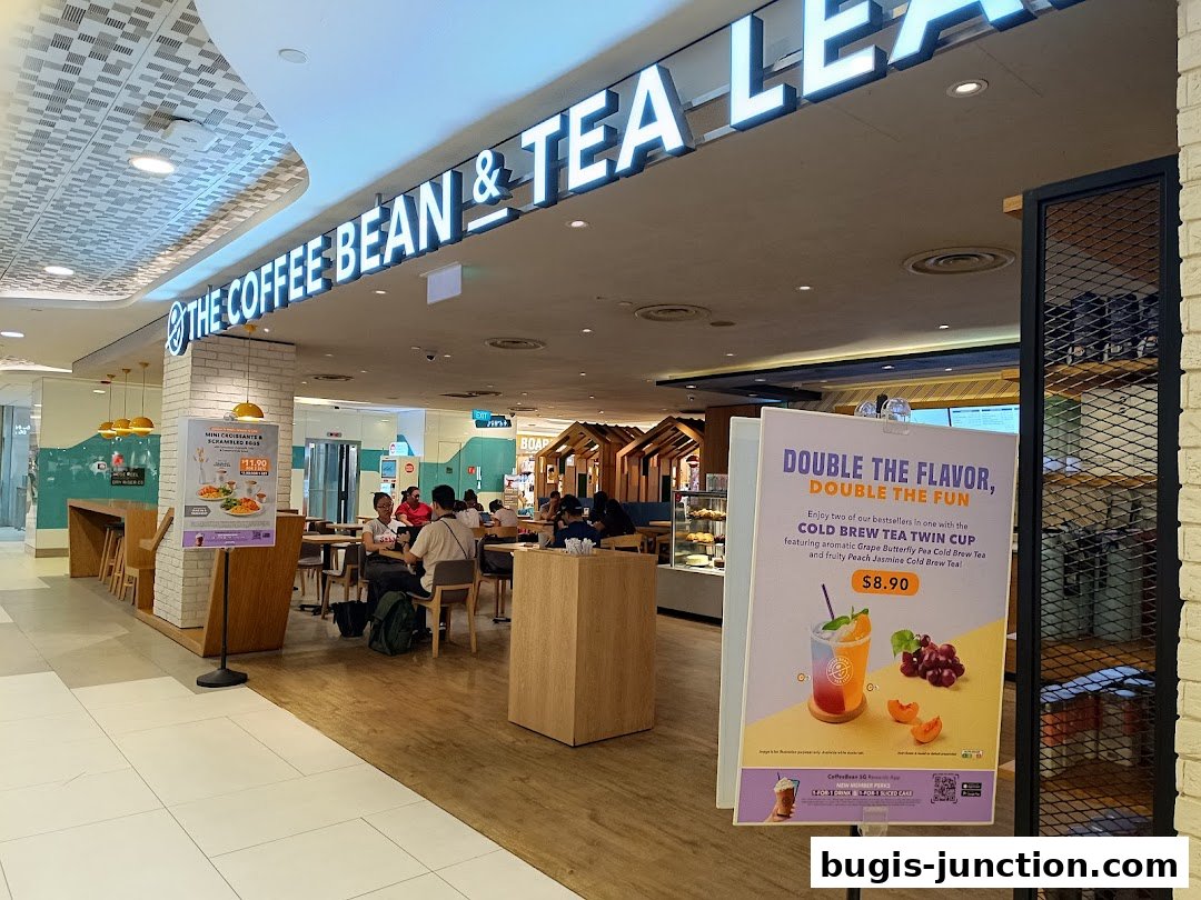 The Coffee Bean & Tea Leaf shop front with seating and promotional signage.