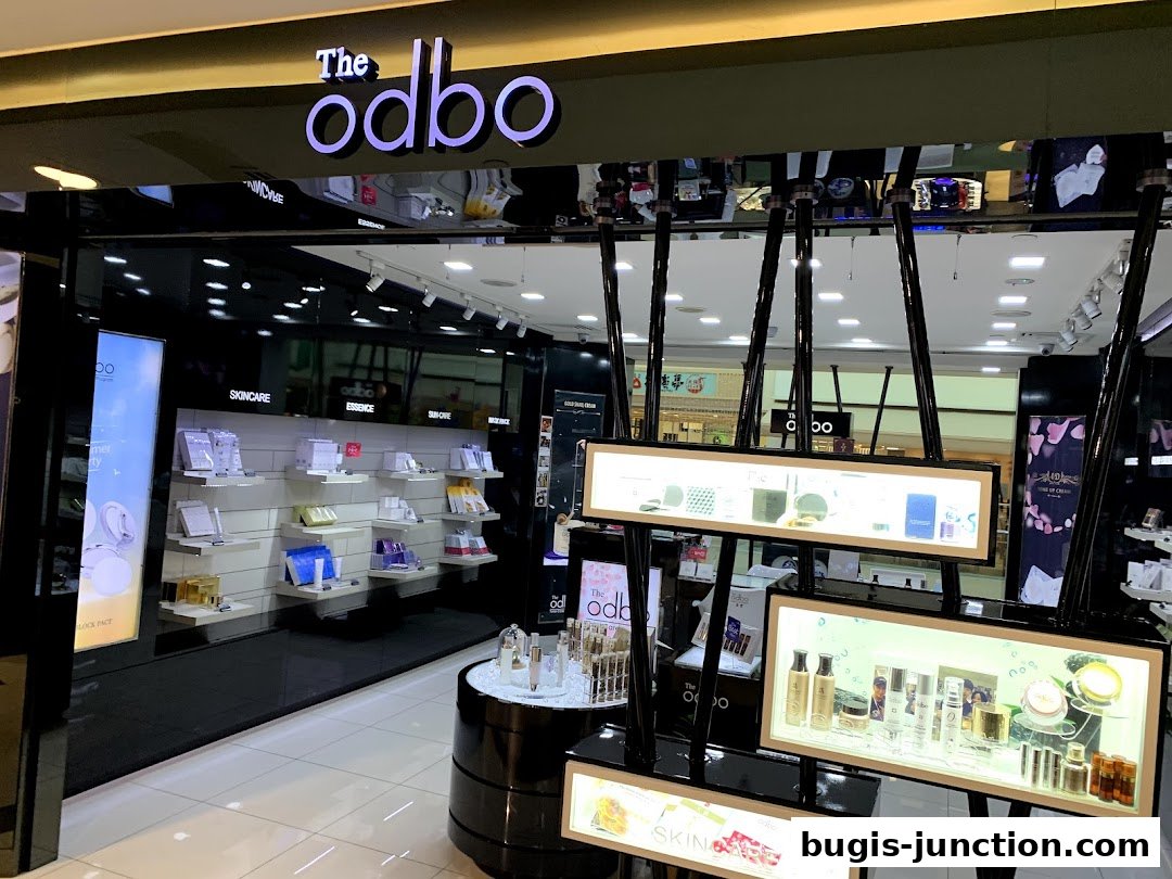 The entrance of a modern beauty store, 'The odbo', showcasing skincare products.