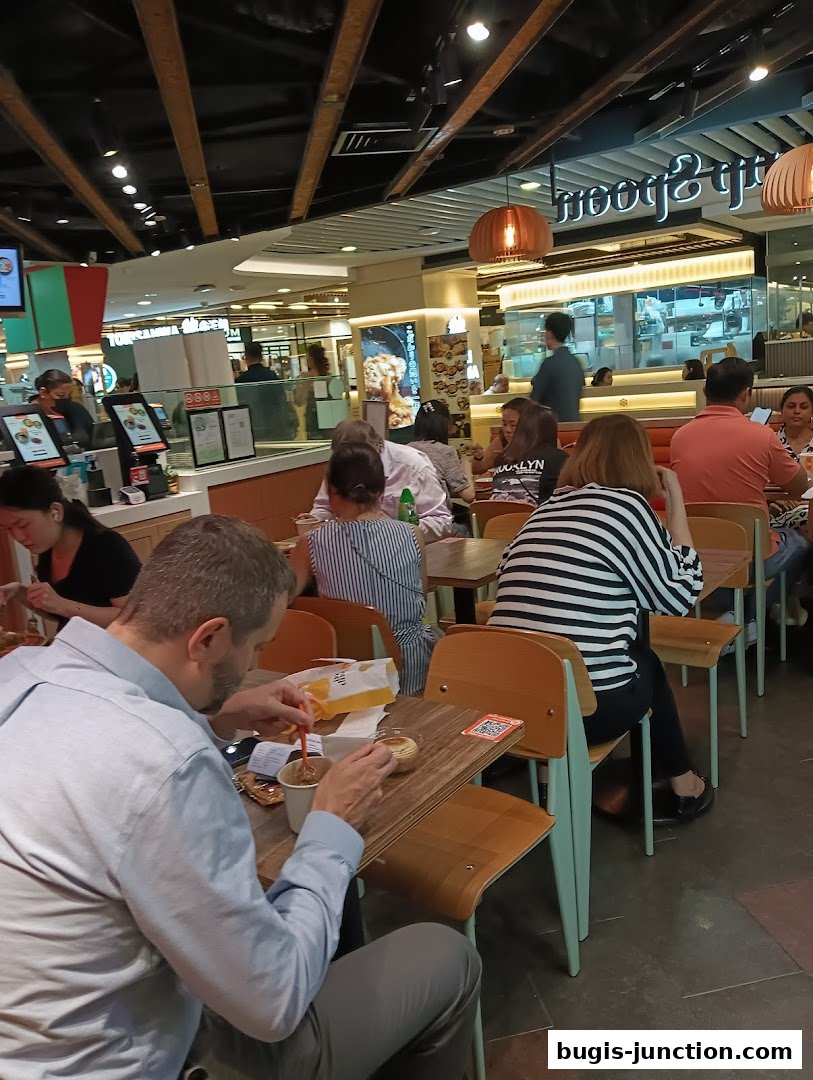 Diners enjoy meals at tables inside The Soup Spoon restaurant.