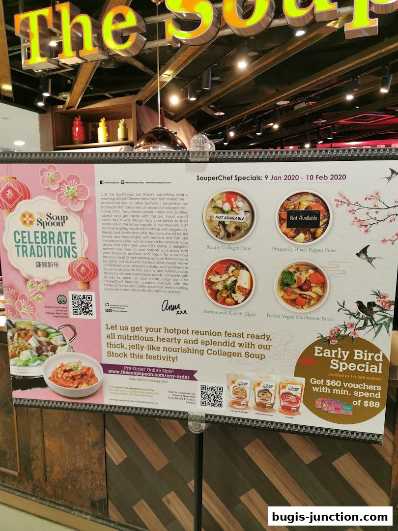 A promotional sign for The Soup Spoon featuring Chinese New Year specials and early bird offers.
