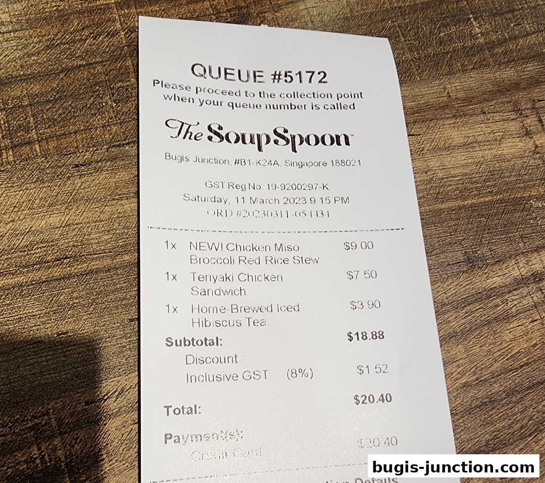 A receipt from The Soup Spoon showing purchased items and total cost.