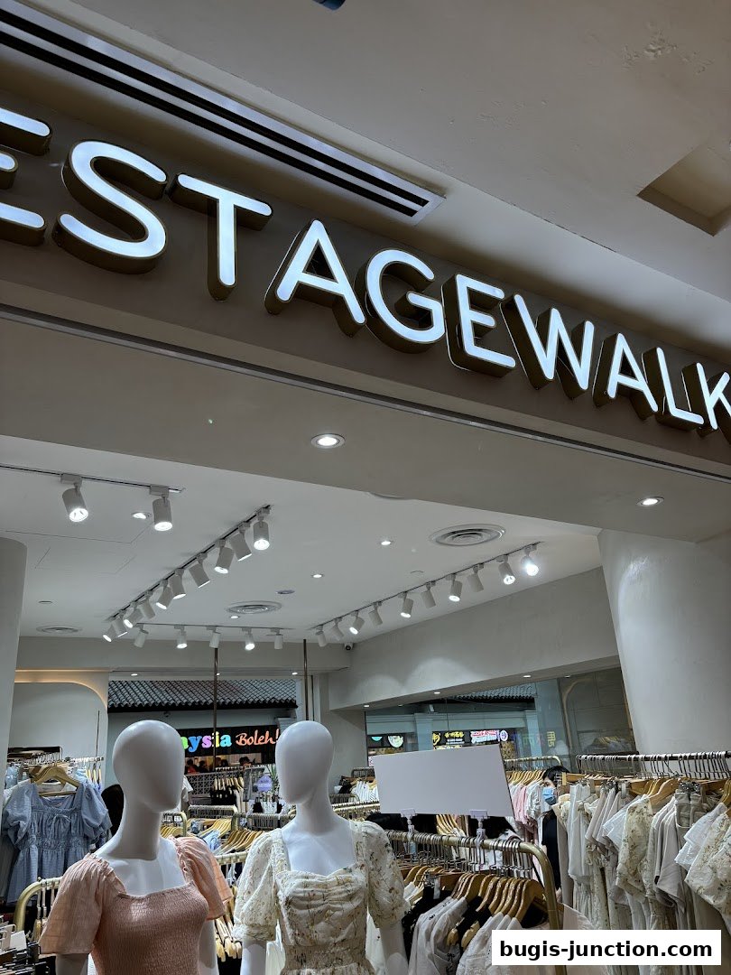 The Stage Walk shop interior with mannequins and clothing displays.