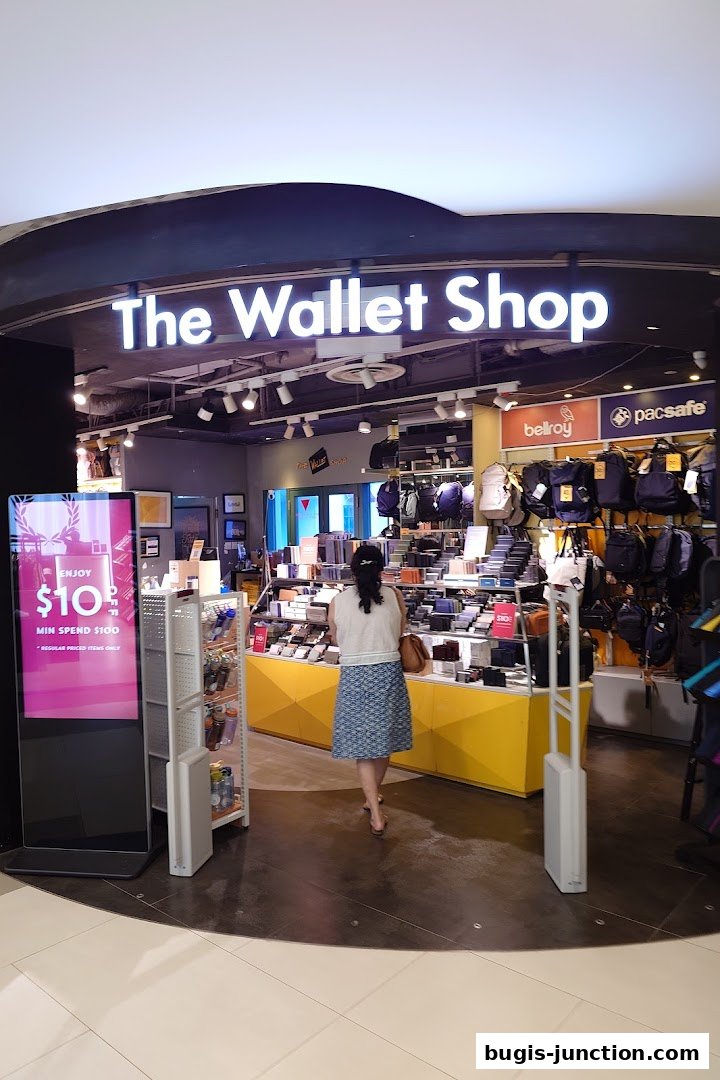 The Wallet Shop storefront with a customer browsing inside.
