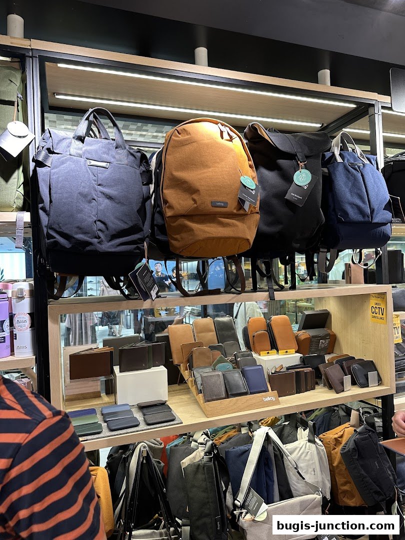 A display of various backpacks and wallets from The Wallet Shop.