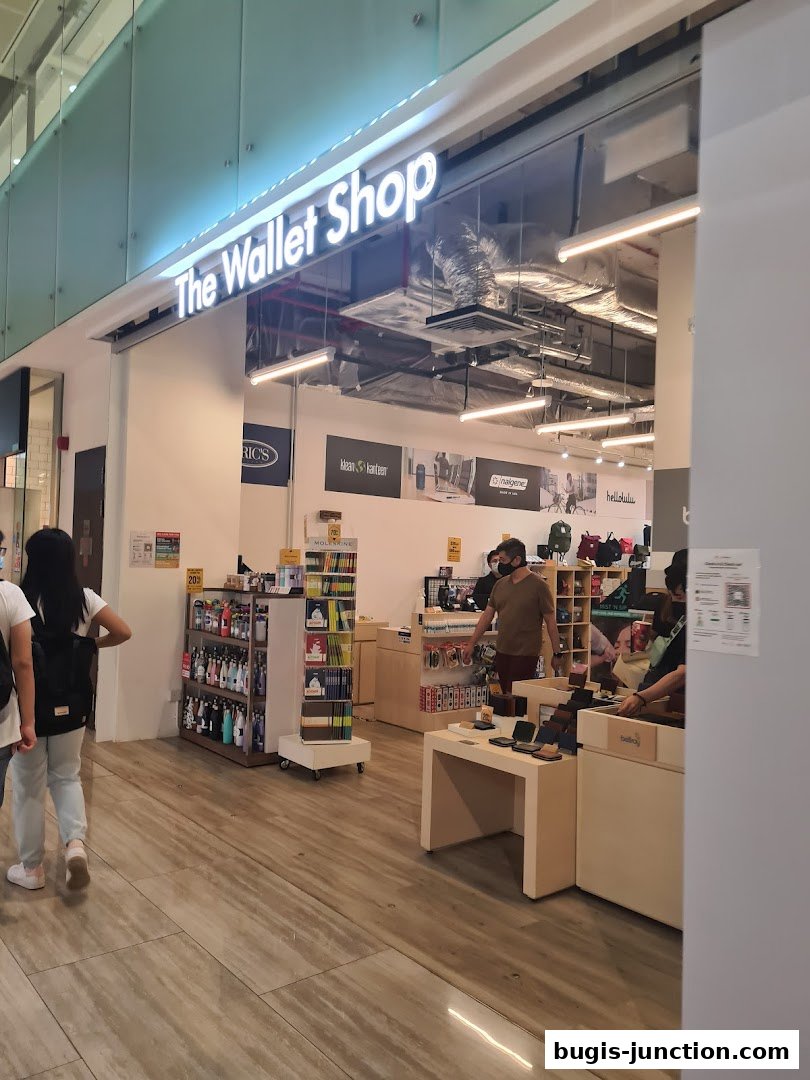 The entrance of 'The Wallet Shop' displaying various wallets and accessories.