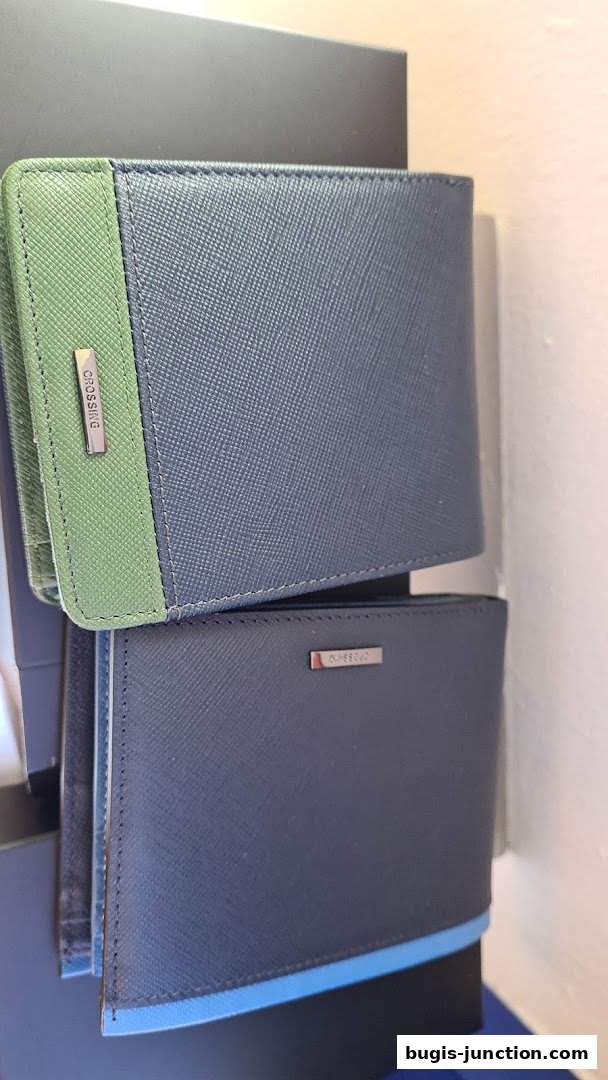 Two stylish wallets, one with a green accent, are displayed.