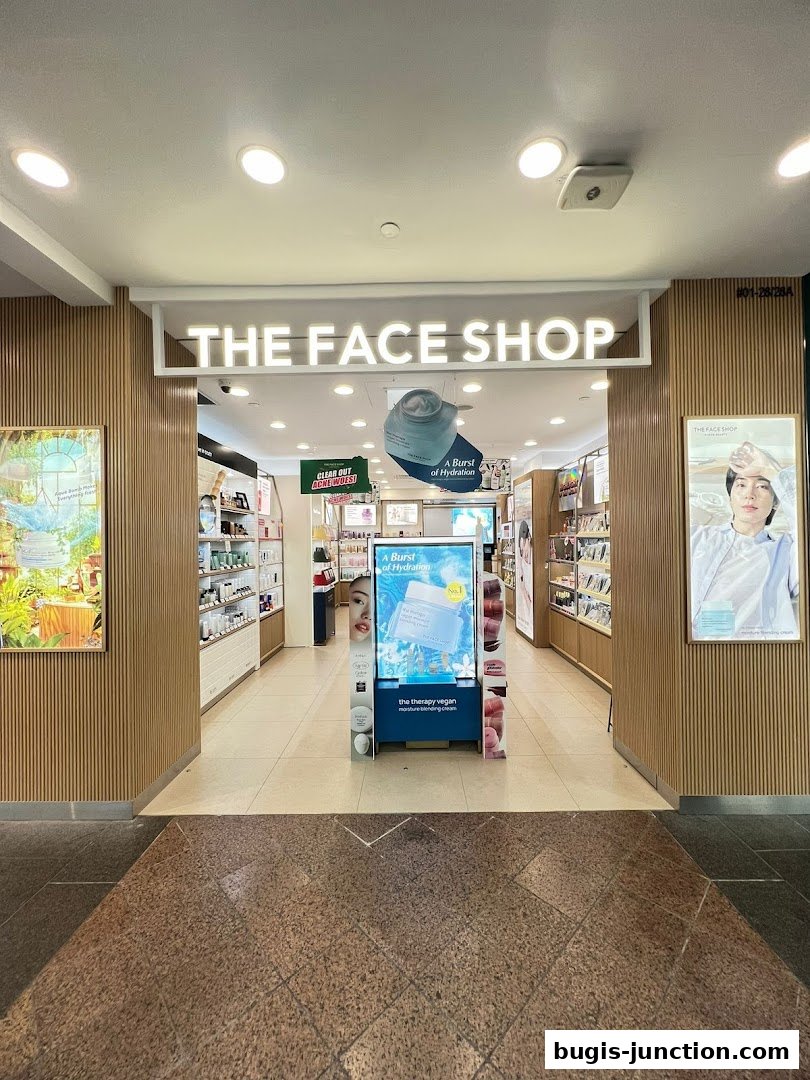 The entrance to THE FACE SHOP, a beauty store, with products displayed inside.