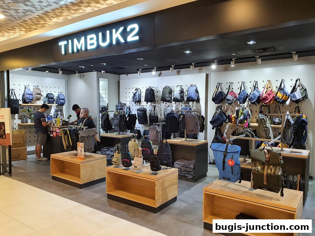 Interior view of a Timbuk2 shop showcasing a wide variety of backpacks and bags.