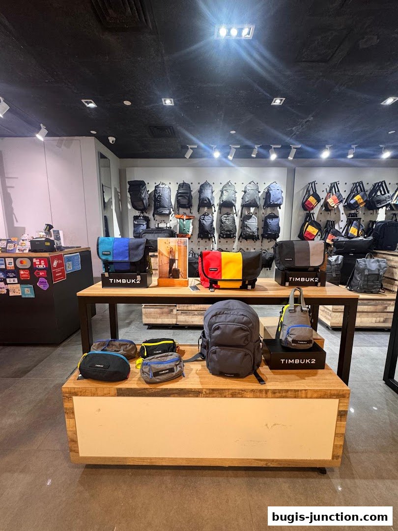 Interior view of a Timbuk2 store showcasing a variety of backpacks and bags.