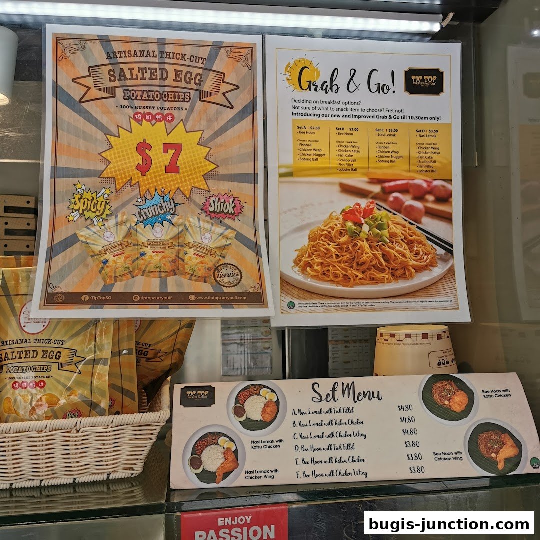 A display of menus and product offerings from Tip Top Curry Puff.