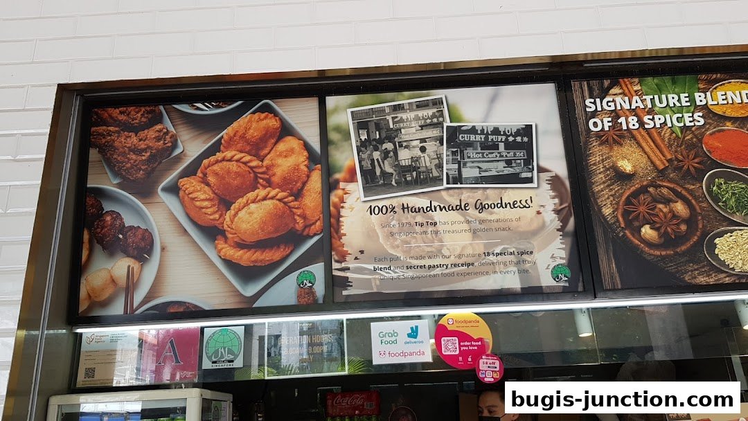 A display showcasing Tip Top Curry Puff's signature handmade goodness and 18-spice blend.