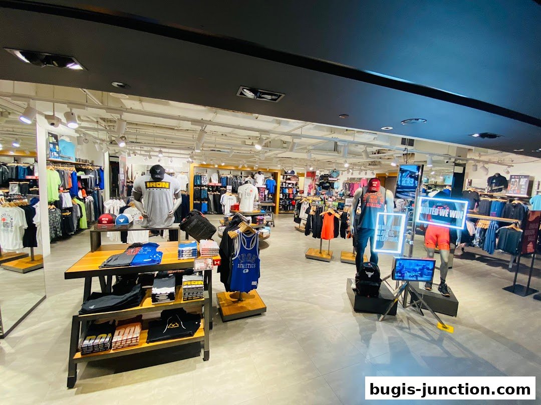 Interior view of an Under Armour store showcasing athletic apparel and mannequins.