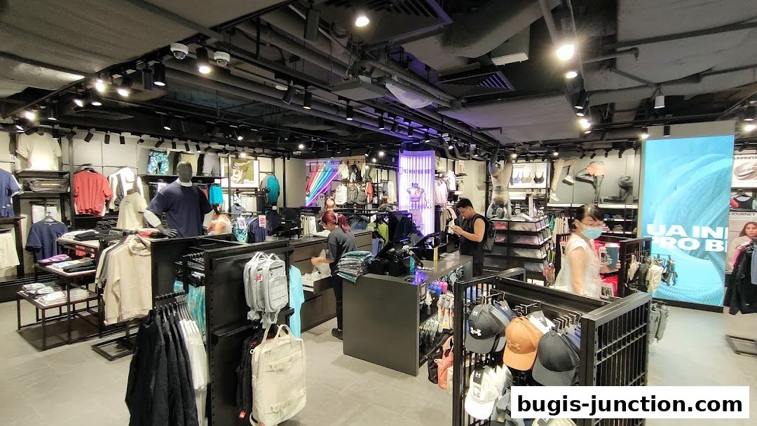 Interior view of an Under Armour store showcasing apparel, accessories, and mannequins.