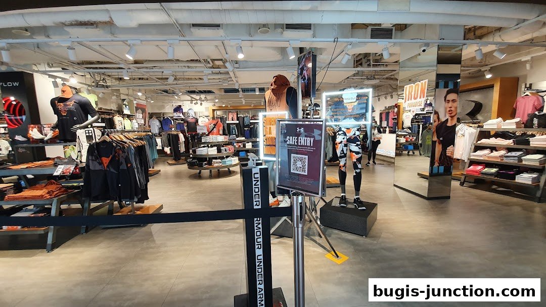 Interior view of an Under Armour store showcasing athletic apparel and mannequins.
