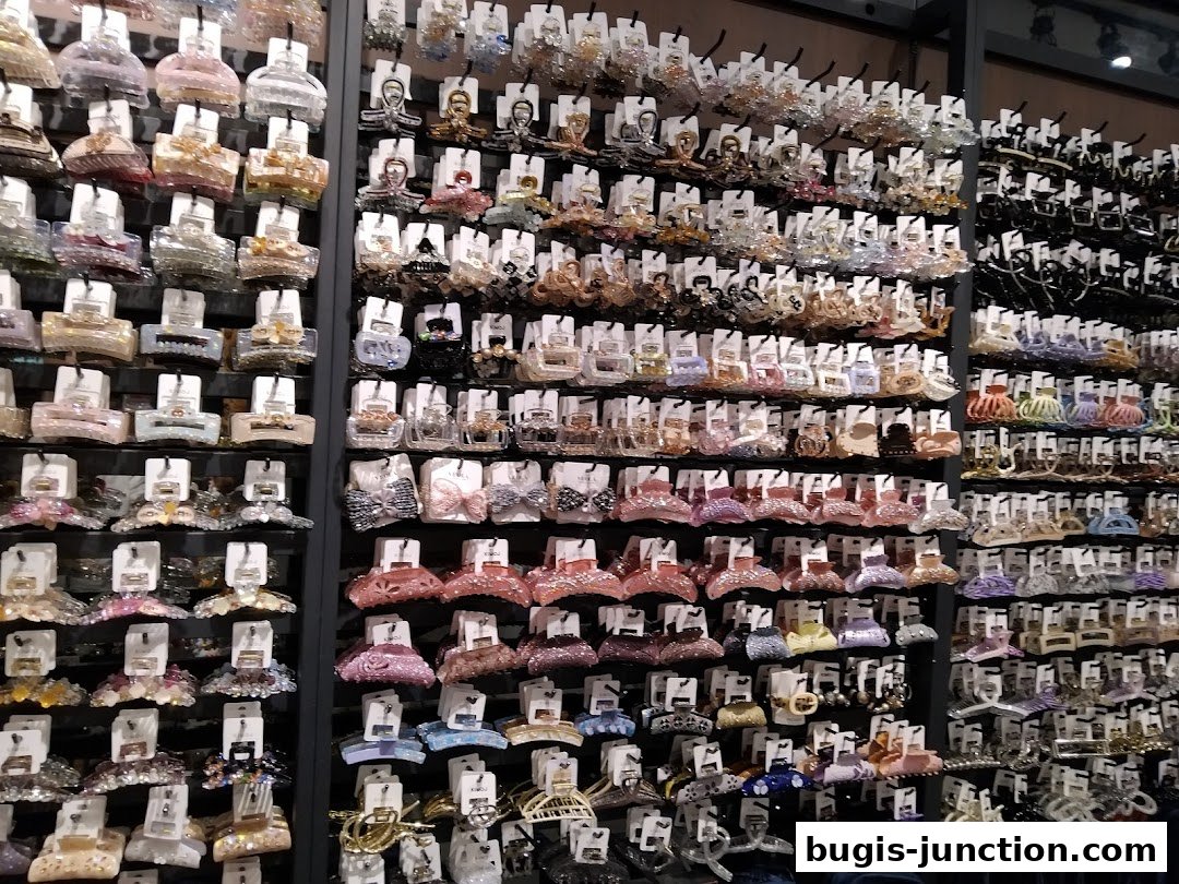 A wall display showcasing a vast collection of colorful and decorative hair claw clips.