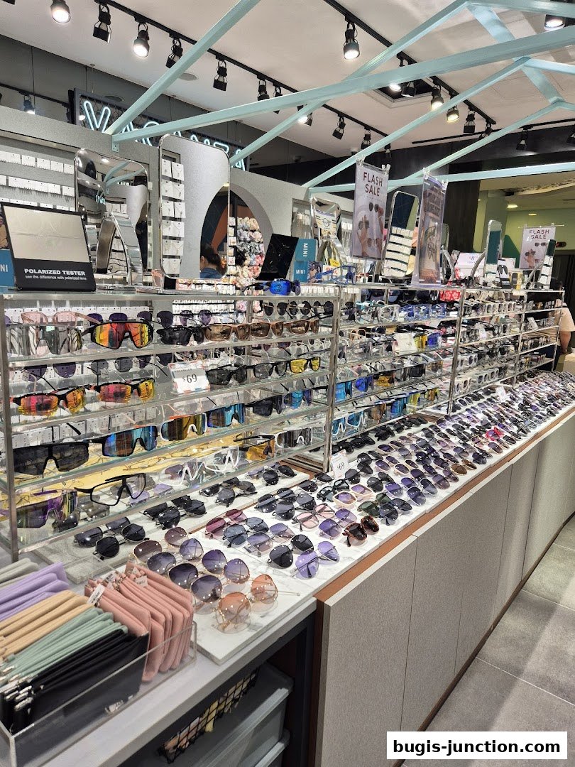 A well-lit shop interior displaying a wide variety of sunglasses and accessories.