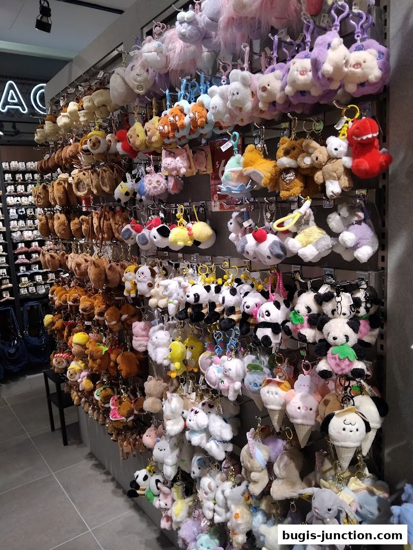 A wall display filled with a variety of cute plush keychains and stuffed animals.