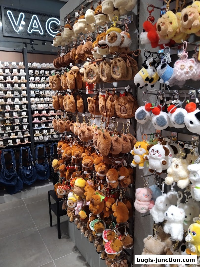 A shop interior displaying a large collection of plush keychains and bags.