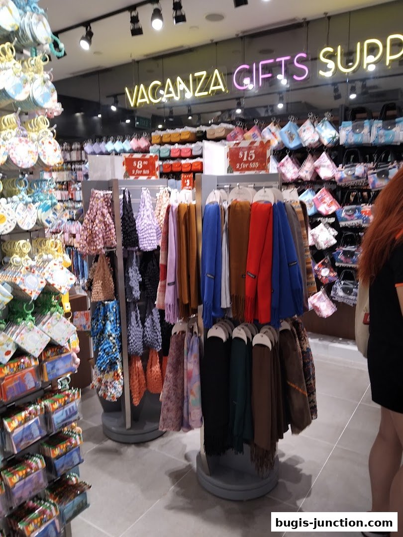 Interior view of Vacanza shop displaying scarves, bags, and gift items.