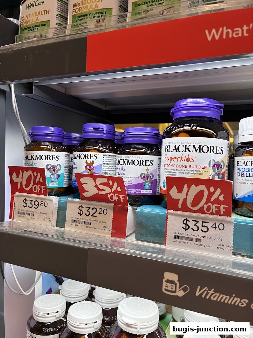 Close-up of Blackmores Superkids vitamins on a shelf with discount tags.