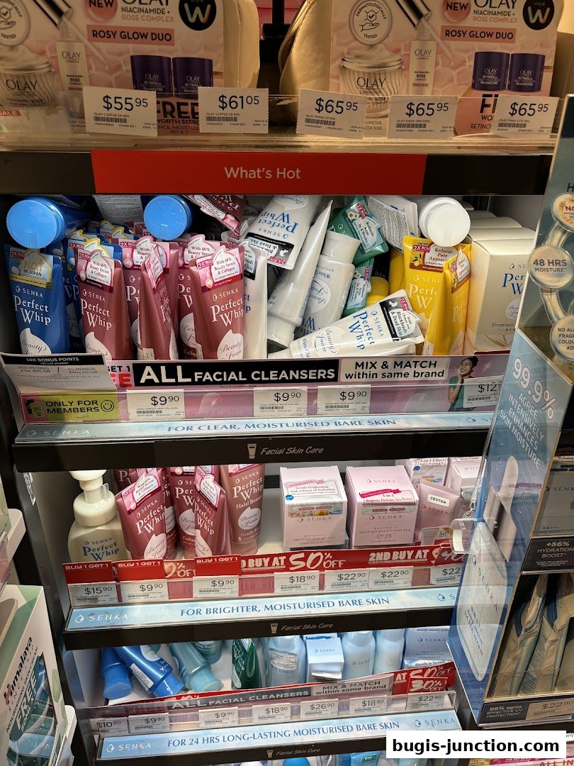 A display of facial cleansers and skincare products, featuring various brands and promotions.