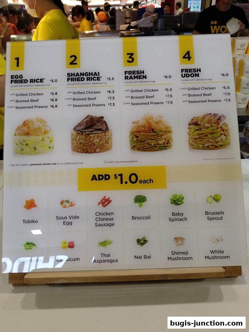 A menu board displaying four main dishes and various add-on ingredients with prices.