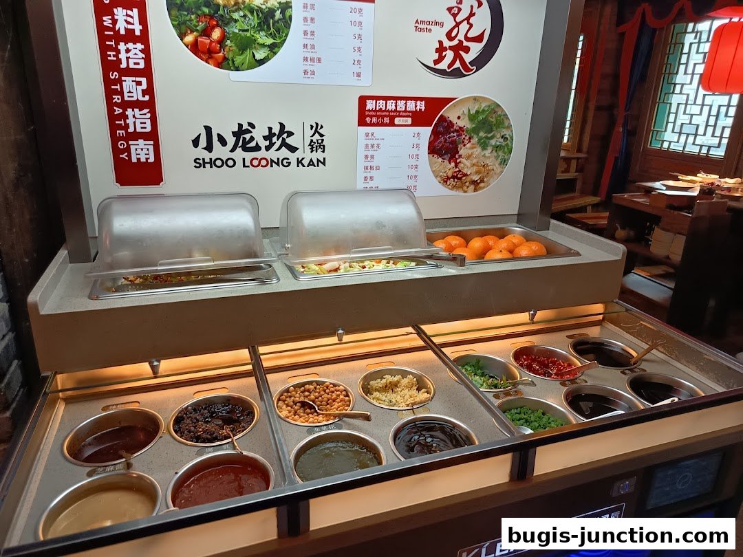 A display of various dipping sauces and ingredients for hotpot at Xiao Long Kan.
