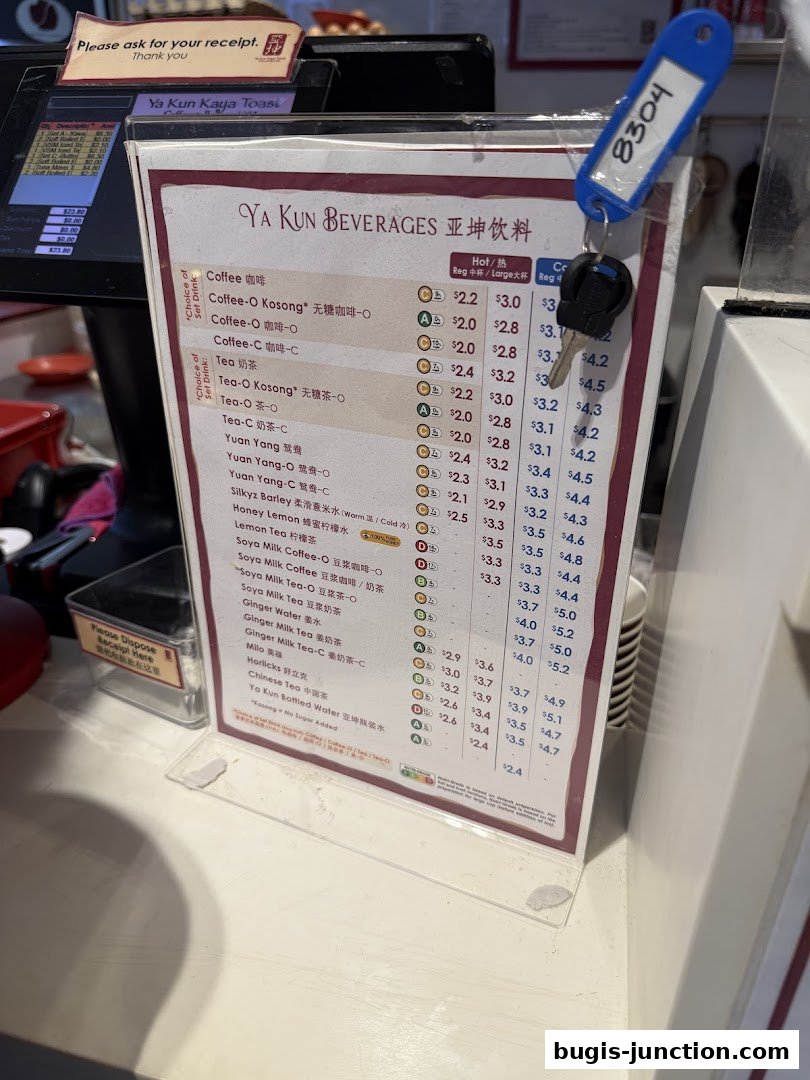 A menu board displaying Ya Kun Kaya Toast beverages with prices and categories.