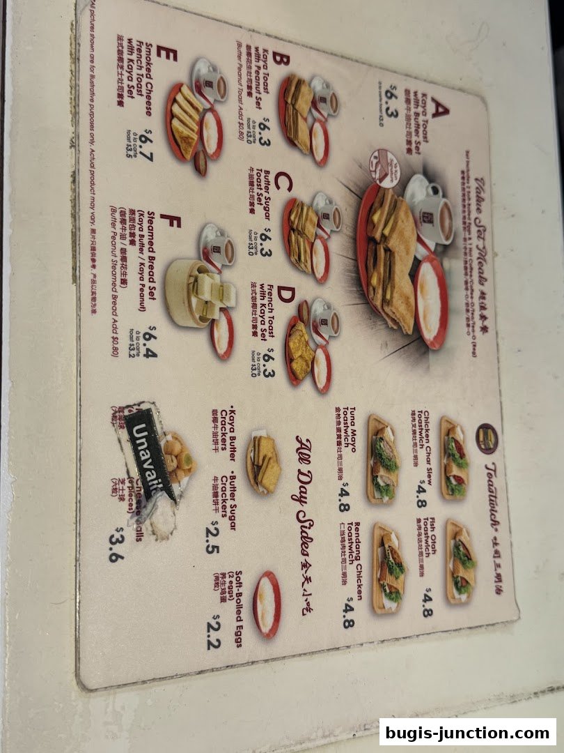 A menu from Ya Kun Kaya Toast featuring various toast sets and sides.