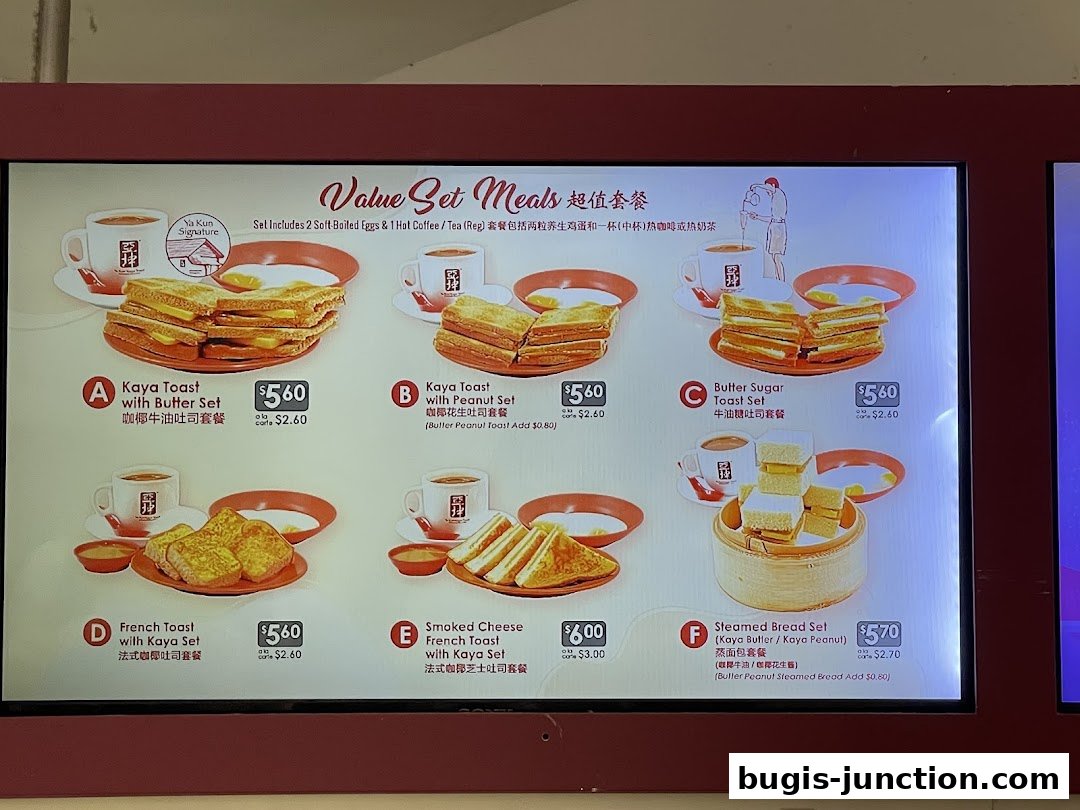 A digital menu board displaying various value set meals from Ya Kun Kaya Toast.