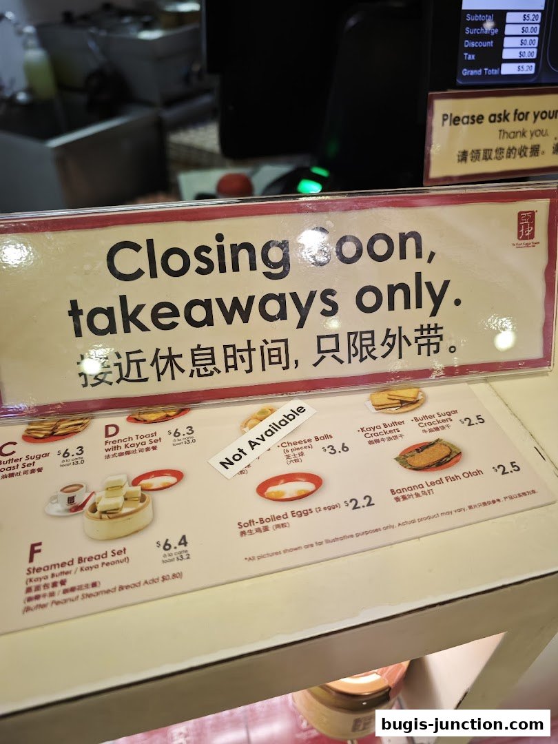 A menu board at Ya Kun Kaya Toast indicating closing soon and takeaways only.