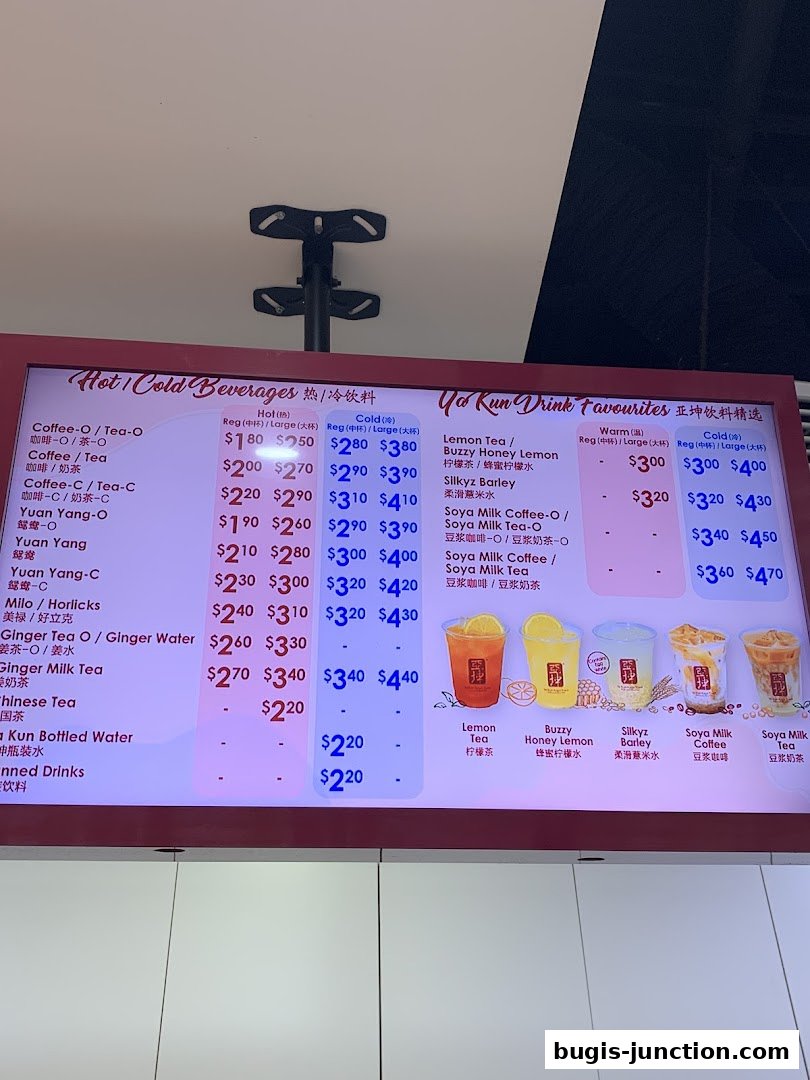 A digital menu board displaying a variety of beverages and their prices at Ya Kun Kaya Toast.