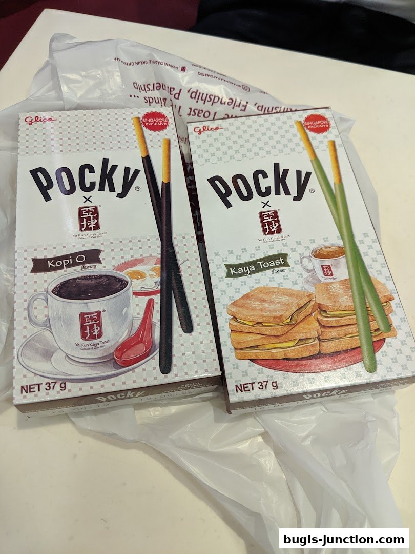 Two boxes of Pocky snacks, one Kopi O flavor and one Kaya Toast flavor, are displayed.
