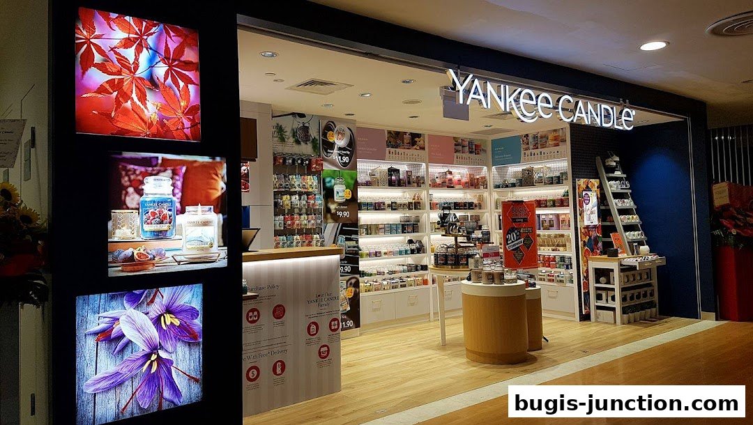 The exterior of a Yankee Candle store, showcasing a wide selection of scented candles and home fragrance products.