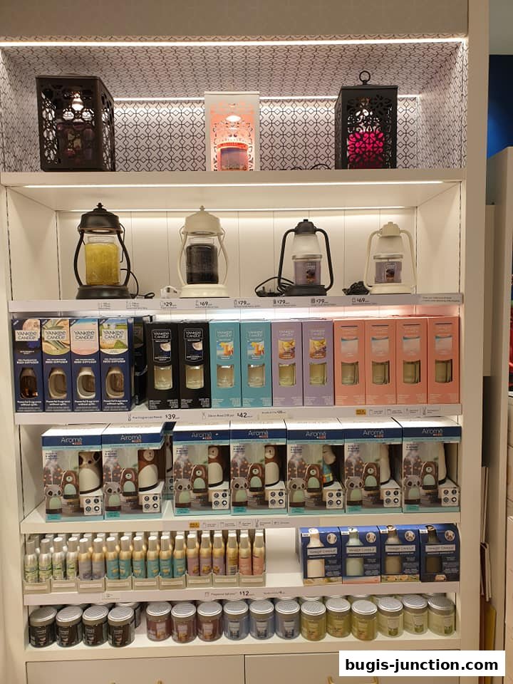 A display of Yankee Candle products including diffusers, candles, and decorative lanterns.