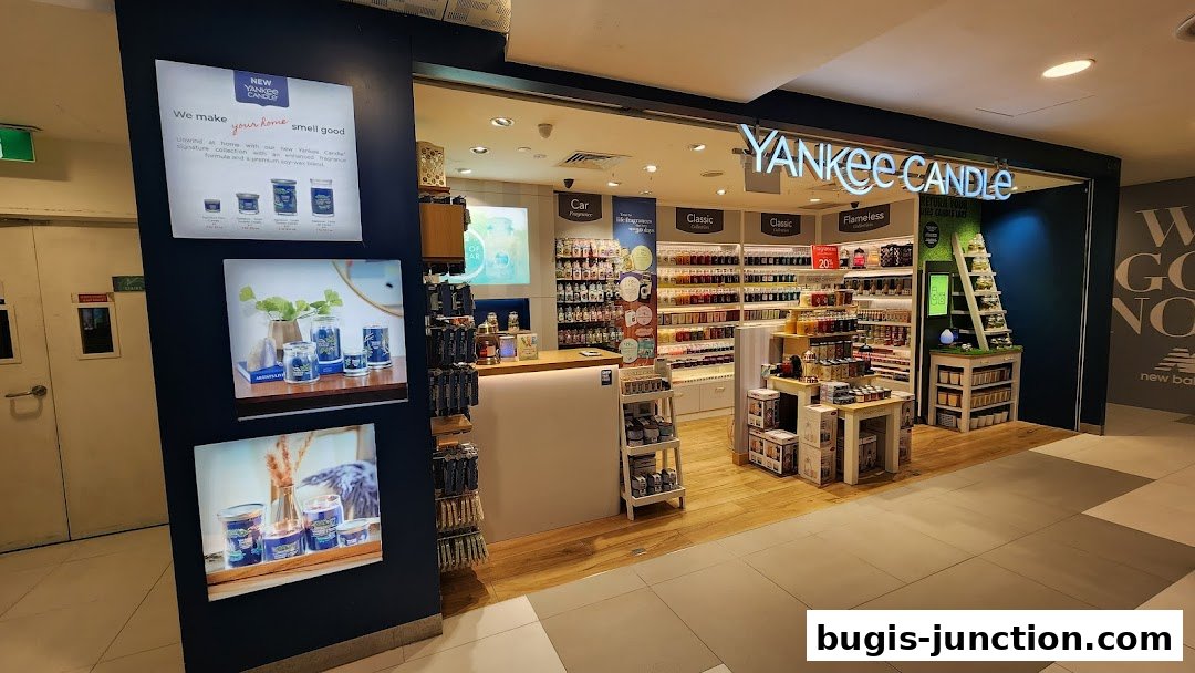 The entrance of a Yankee Candle store showcasing a wide variety of scented candles and home fragrance products.